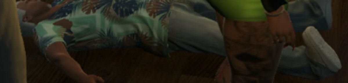 A man in a patterned shirt lying on the floor of the coffee shop