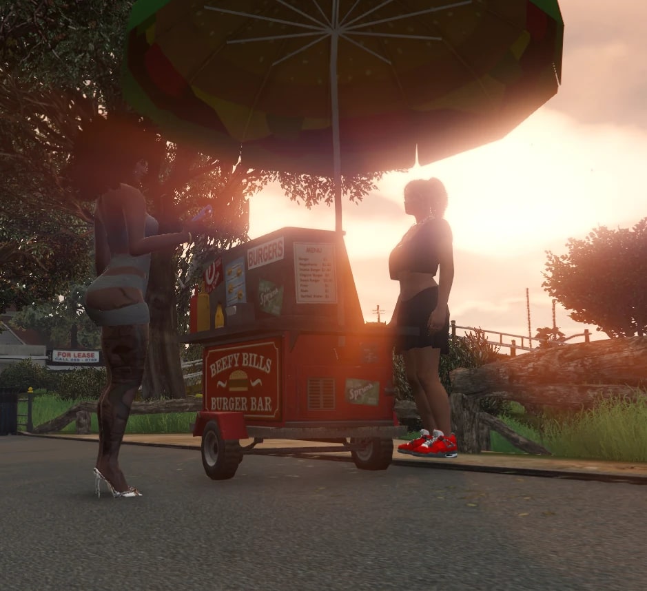 At sunset, a resident stands at the red Beefy Bills Burger Bar cart as Ethel serves from the other side