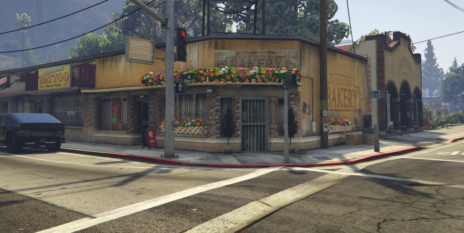 Krokus Flowers on a Paleto Bay street corner, its awning lined with window boxes of orange, pink and white flowers beneath old bakery lettering